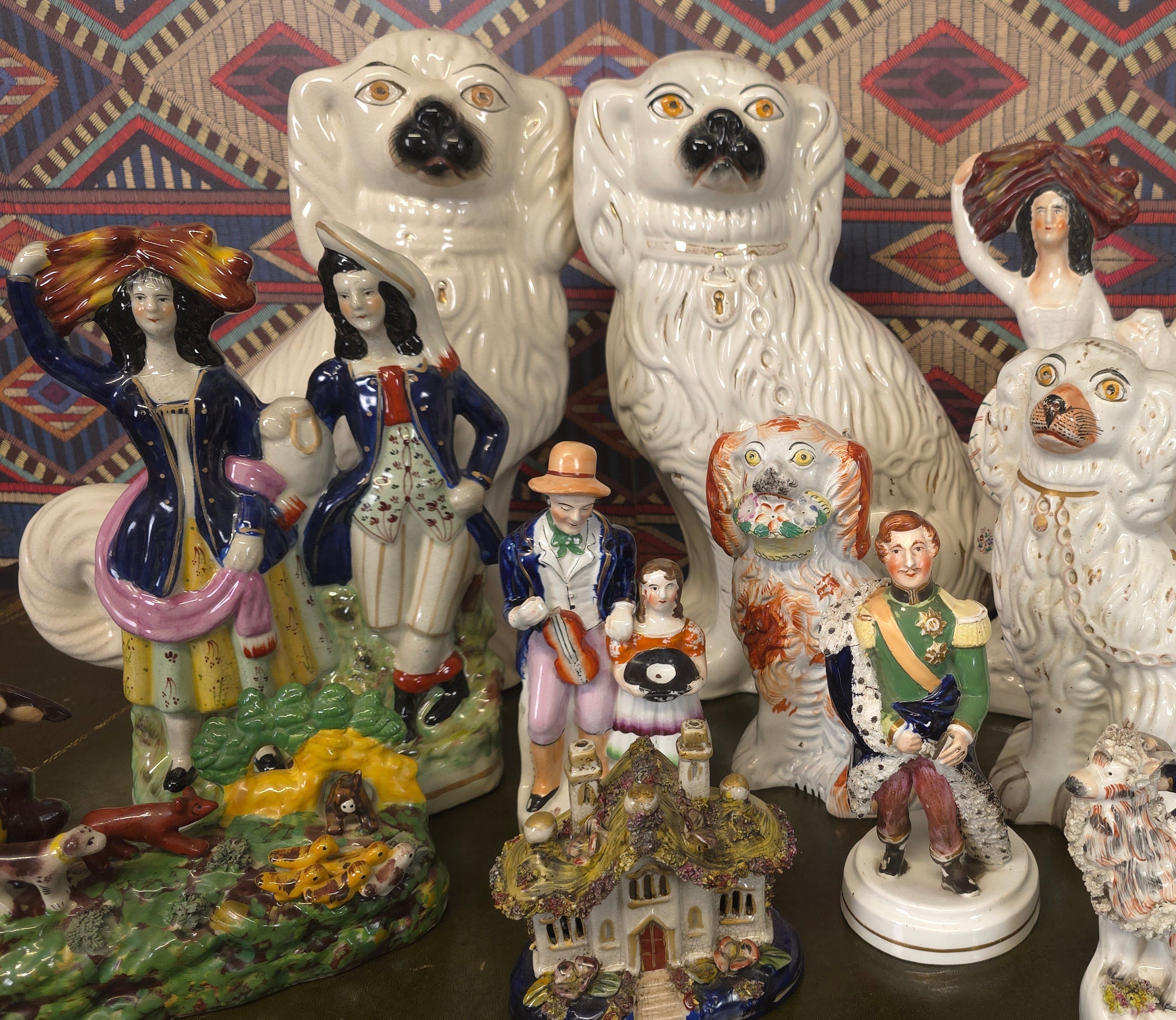 Collection of decorative figurines with a patterned background