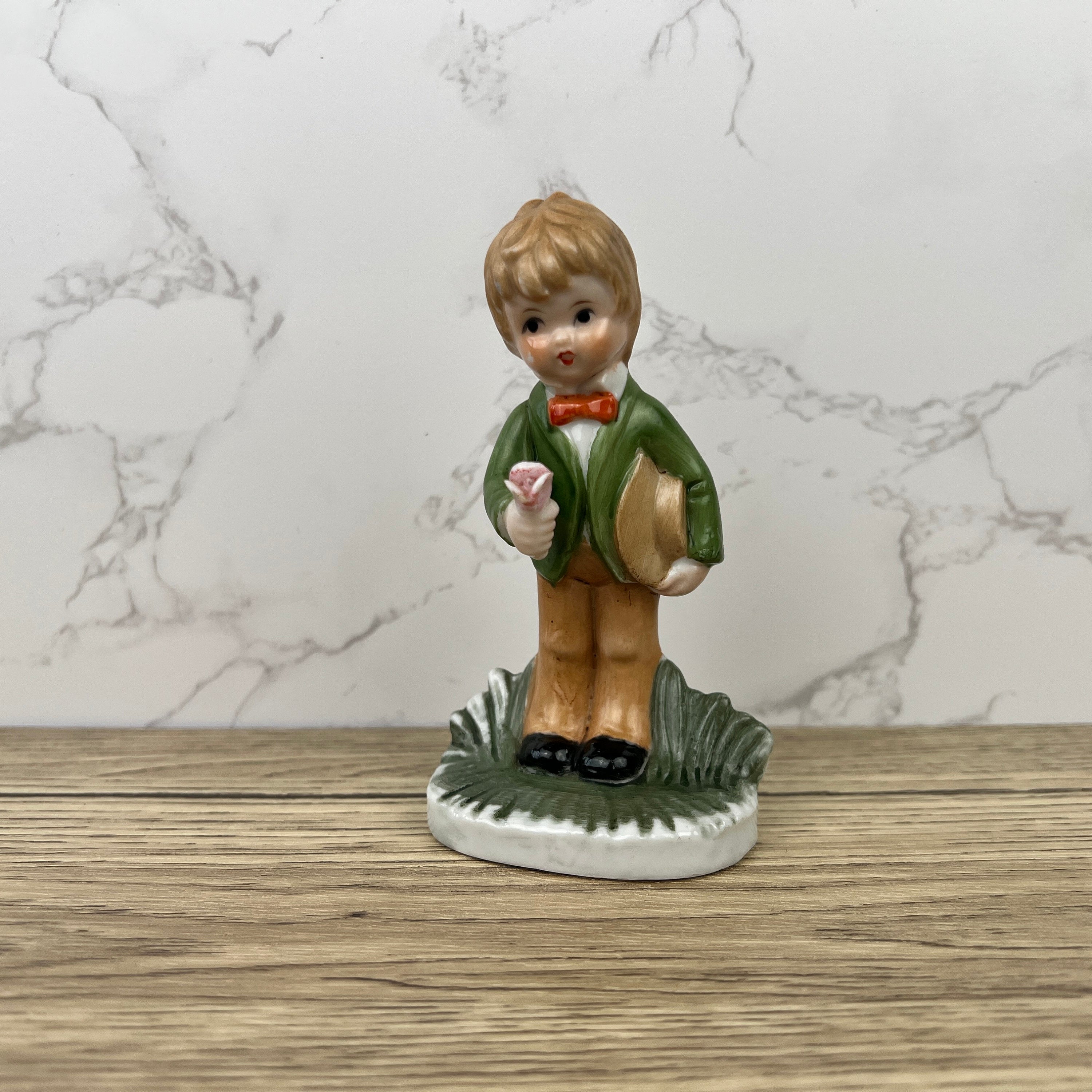 Alfretto Porcelain Boy Figurine with Flower, Handmade Crown Stamp