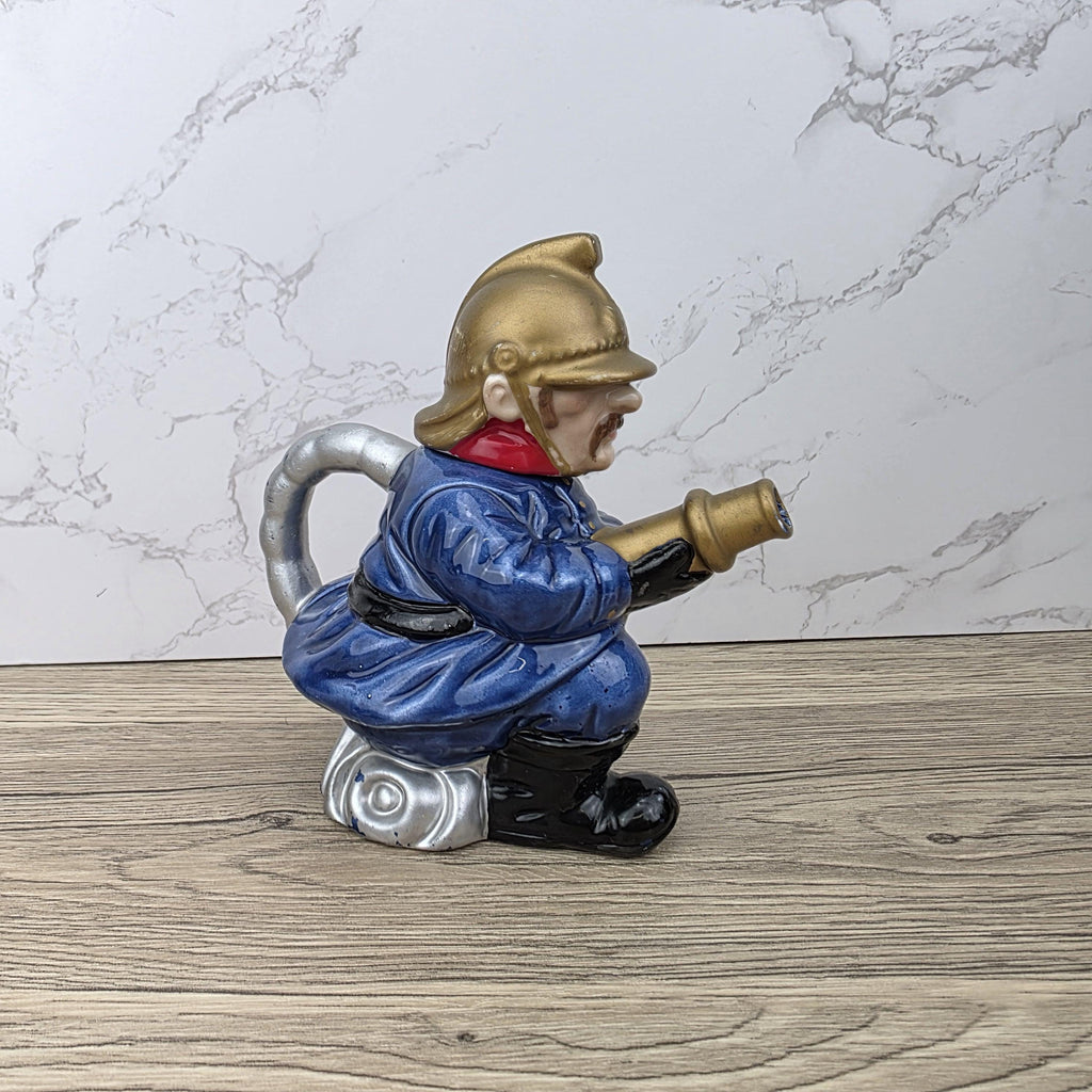 Vintage Leonardo Fireman Figurine with Hose | Decorative Ceramic Teapot Style Ornament | Collectible Sculpture