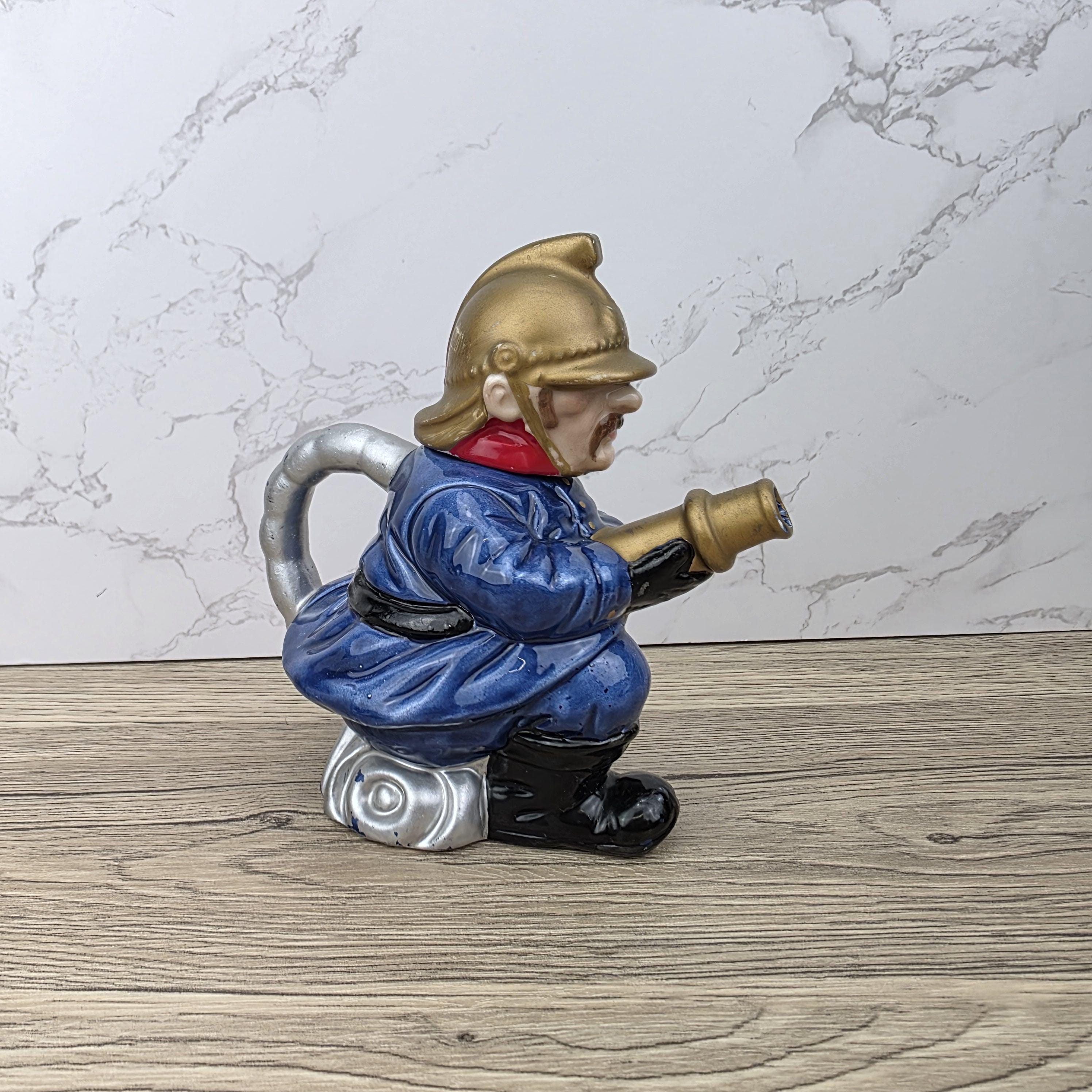 Vintage Leonardo Fireman Figurine with Hose | Decorative Ceramic Teapot Style Ornament | Collectible Sculpture