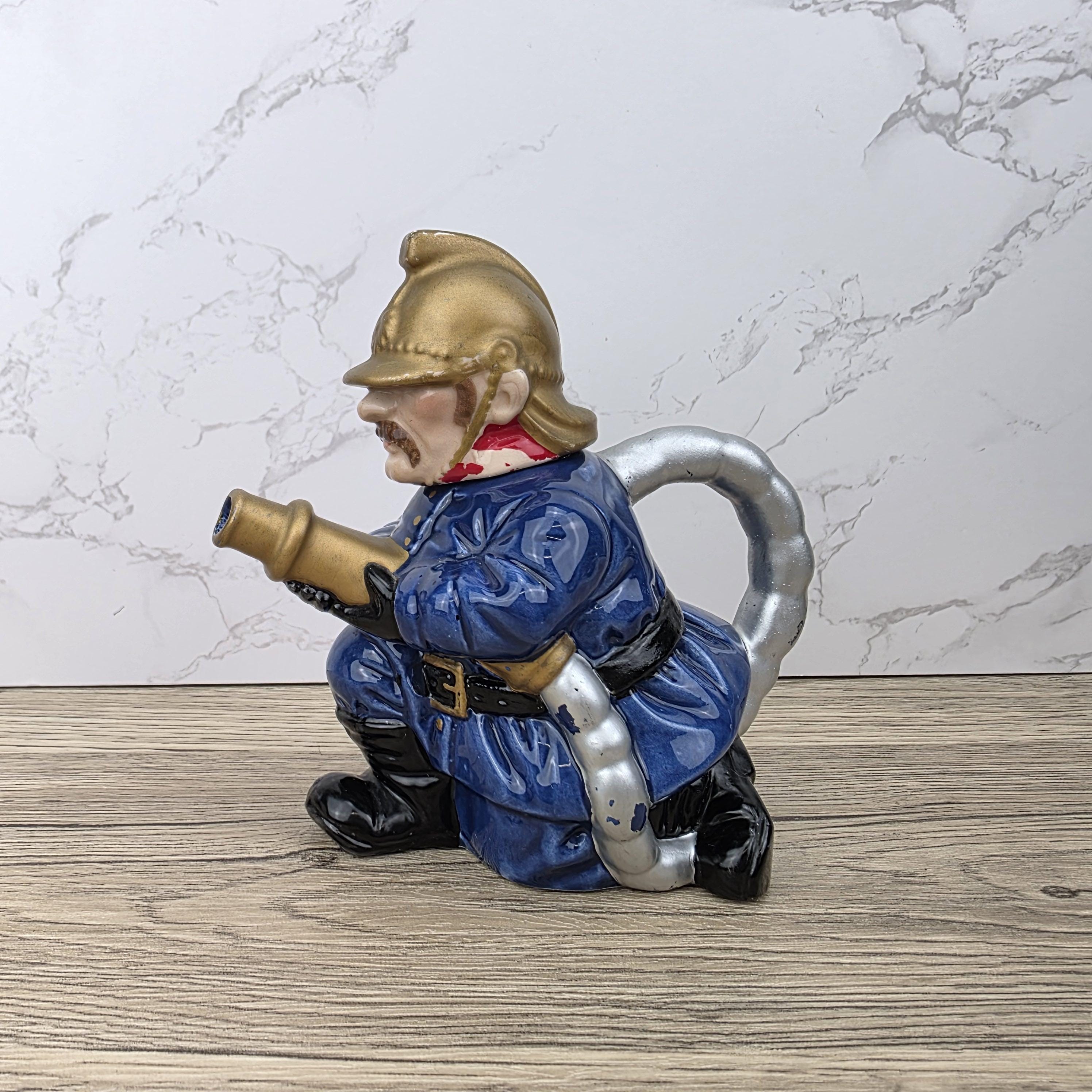 Vintage Leonardo Fireman Figurine with Hose | Decorative Ceramic Teapot Style Ornament | Collectible Sculpture