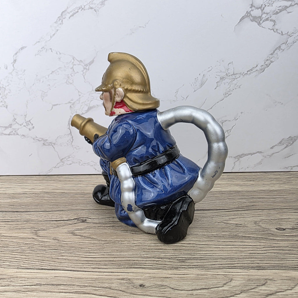 Vintage Leonardo Fireman Figurine with Hose | Decorative Ceramic Teapot Style Ornament | Collectible Sculpture