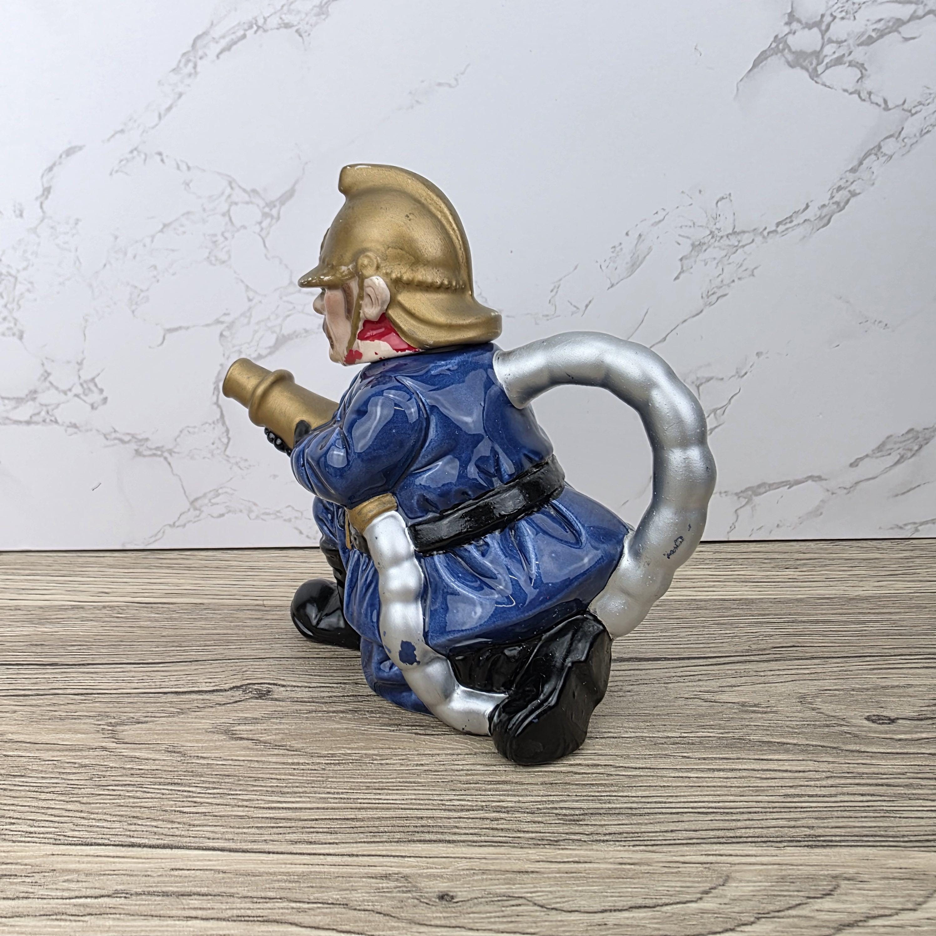 Vintage Leonardo Fireman Figurine with Hose | Decorative Ceramic Teapot Style Ornament | Collectible Sculpture