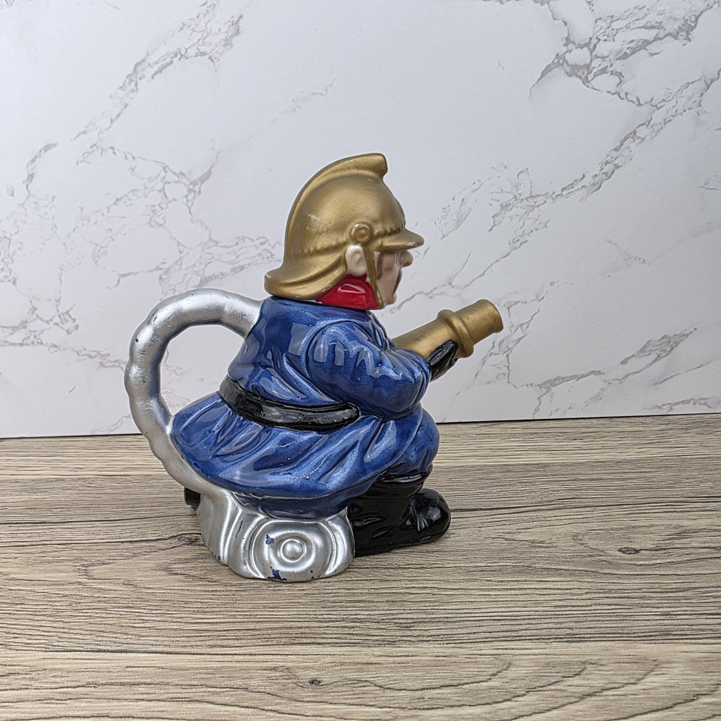 Vintage Leonardo Fireman Figurine with Hose | Decorative Ceramic Teapot Style Ornament | Collectible Sculpture